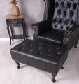 czarny fotel uszak z podnóżkiem styl chesterfield